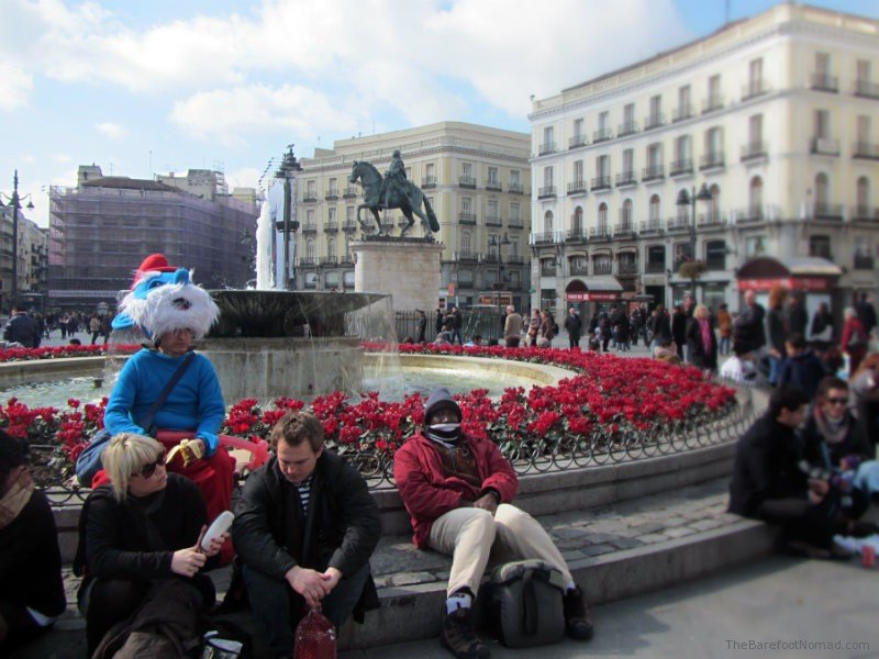 Unique things to do in Madrid Papa Smurf costume in Plaza del Sol Madrid